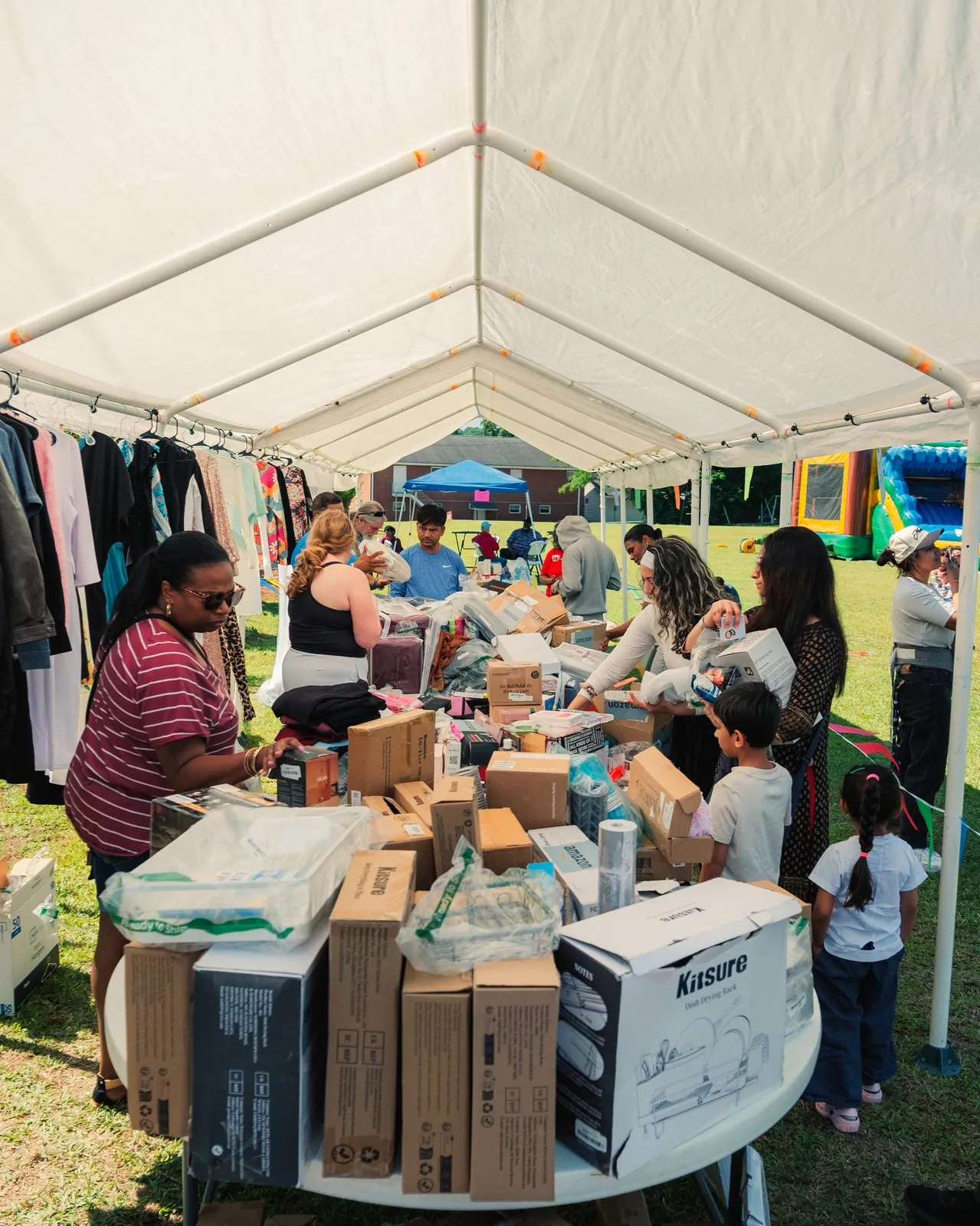 Volunteers and families at a Good Neighbor Day distribution event