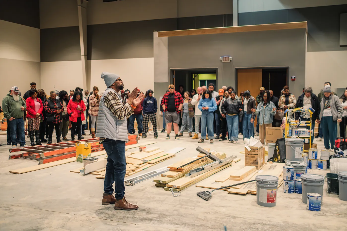 Community members dedicating a new MW Hope Center space in prayer